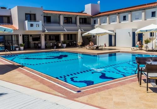 Pool and sunbeds at Castello Village in Sissi, Crete