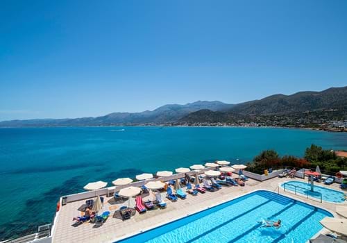 Main pool area with sea views at the Horizon Beach Hotel in Stalis, Crete.